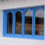 Gothic-arched hardwood window